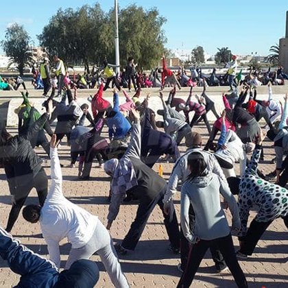 Demonstrating Asanas (i.e., yogic poses) in Tunisia 