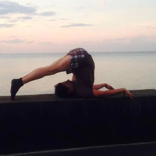 Halasana demonstration for yoga on the lake