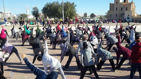 Demonstrating Asanas (i.e., yogic poses) in Tunisia 